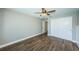 Spacious bedroom with wood floors and double doors at 550 Johns Pass Ave, Madeira Beach, FL 33708
