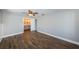 Bright bedroom with ensuite bathroom and wood floors at 550 Johns Pass Ave, Madeira Beach, FL 33708