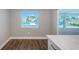 Bright dining area with water views and wood flooring at 550 Johns Pass Ave, Madeira Beach, FL 33708