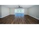 Spacious living room with hardwood floors and water views at 550 Johns Pass Ave, Madeira Beach, FL 33708