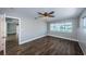 Bedroom with wood floors, water views and ceiling fan at 550 Johns Pass Ave, Madeira Beach, FL 33708