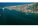 Aerial perspective showcasing a coastal town and bridge at 550 Johns Pass Ave, Madeira Beach, FL 33708