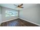 Bright bedroom with water views and ceiling fan at 550 Johns Pass Ave, Madeira Beach, FL 33708