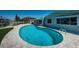 Enjoy this kidney-shaped pool with canal views at 550 Johns Pass Ave, Madeira Beach, FL 33708