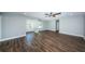 Open living area with hardwood floors and neutral walls at 550 Johns Pass Ave, Madeira Beach, FL 33708