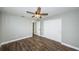Bright bedroom with wood floors and ceiling fan at 550 Johns Pass Ave, Madeira Beach, FL 33708
