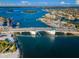 Aerial view of a bridge and coastal neighborhood at 550 Johns Pass Ave, Madeira Beach, FL 33708