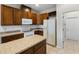Kitchen with wood cabinets and island at 2622 Yukon Cliff Dr, Ruskin, FL 33570