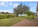 Brick patio overlooking a pond and lush greenery at 2622 Yukon Cliff Dr, Ruskin, FL 33570