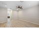 Large bedroom with ceiling fan and laminate wood flooring at 2622 Yukon Cliff Dr, Ruskin, FL 33570