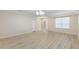 Light and airy living room with wood-look floors at 2622 Yukon Cliff Dr, Ruskin, FL 33570