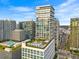 High-rise building exterior with rooftop pool, lounge area, and surrounding city views at 1000 Water St # 1703, Tampa, FL 33602