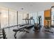 Well-equipped gym featuring treadmills, elliptical, bench, and free weights, promoting a healthy lifestyle at 1000 Water St # 1703, Tampa, FL 33602