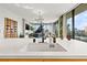 Open-concept kitchen view with stylish finishes, including a wine rack and large windows to the living area at 1000 Water St # 1703, Tampa, FL 33602