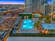 Stunning rooftop pool with lounge chairs and umbrellas, offering a luxurious urban retreat with city views at 1000 Water St # 1703, Tampa, FL 33602