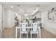 Bright living room featuring a modern open kitchen and dining table at 400 150Th Ave # 301, Madeira Beach, FL 33708