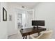 Well-lit office featuring hardwood desk, neutral chair, and bright white walls at 400 150Th Ave # 301, Madeira Beach, FL 33708