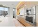 Modern kitchen with double oven and light wood cabinets at 1000 Water St # 1703, Tampa, FL 33602