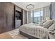 Bedroom with wood closets and city view at 1000 Water St # 1703, Tampa, FL 33602