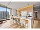 Modern kitchen with island, quartz countertops, and stainless steel appliances at 1000 Water St # 1703, Tampa, FL 33602