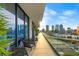 Spacious balcony with city views and modern furniture at 1000 Water St # 1703, Tampa, FL 33602