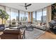 Luxury living room with a modern sectional sofa and city view at 1000 Water St # 1703, Tampa, FL 33602