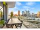 Private balcony with modern furniture and city views at 1000 Water St # 1703, Tampa, FL 33602