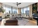 Light-filled living room with sectional sofa and city views at 1000 Water St # 1703, Tampa, FL 33602