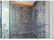 Walk-in shower with pebble floor and mosaic tile at 1000 Water St # 1703, Tampa, FL 33602