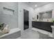 Large bathroom with double vanity and grey tile at 4511 24Th S Ave, St Petersburg, FL 33711