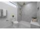 Modern bathroom with walk-in shower, toilet and gold accents at 4511 24Th S Ave, St Petersburg, FL 33711