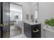 Stylish bathroom with dark vanity and gold accents at 4511 24Th S Ave, St Petersburg, FL 33711