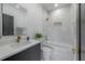 Modern bathroom with white marble and gold fixtures at 4511 24Th S Ave, St Petersburg, FL 33711