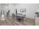 Bright dining room with modern table and chairs, hardwood floors at 4511 24Th S Ave, St Petersburg, FL 33711