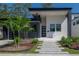 Modern house with gray and white exterior, landscaping, and walkway at 4511 24Th S Ave, St Petersburg, FL 33711