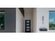 Modern home's entrance with gray and white exterior and walkway at 4511 24Th S Ave, St Petersburg, FL 33711