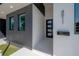 Modern home's entrance with gray and white exterior and walkway at 4511 24Th S Ave, St Petersburg, FL 33711