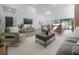Open living area with modern furniture, large TV, and access to kitchen at 4511 24Th S Ave, St Petersburg, FL 33711