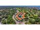 Community featuring terra cotta roofs, a community pool, lush landscaping, and nearby water at 6251 Vista Verde W Dr, St Petersburg, FL 33707