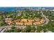 Community featuring terra cotta roofs, mature trees, and proximity to water and golf at 6251 Vista Verde W Dr, St Petersburg, FL 33707