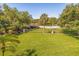 Landscaped backyard with lush greenery and a view of a canal at 6251 Vista Verde W Dr, St Petersburg, FL 33707