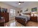 Serene bedroom with a wooden bed frame and coastal-themed art at 6251 Vista Verde W Dr, St Petersburg, FL 33707