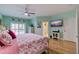 Spacious bedroom with king-size bed and ensuite bathroom access at 6251 Vista Verde W Dr, St Petersburg, FL 33707