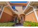 Inviting entryway with stylish decor, a welcome sign, and well-maintained landscaping at 6251 Vista Verde W Dr, St Petersburg, FL 33707