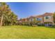 Two-story townhouses with balconies and a large lawn at 6251 Vista Verde W Dr, St Petersburg, FL 33707