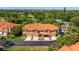 Beautiful townhomes with terracotta roofs, garages, and landscaped yards in a gated community with golf course views at 6251 Vista Verde W Dr, St Petersburg, FL 33707