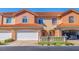 Two-story townhouse with attached garage and manicured lawn at 6251 Vista Verde W Dr, St Petersburg, FL 33707