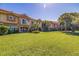 Two-story townhouses with lush landscaping and a manicured lawn at 6251 Vista Verde W Dr, St Petersburg, FL 33707