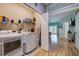 Convenient laundry room with washer, dryer, and storage shelves at 6251 Vista Verde W Dr, St Petersburg, FL 33707