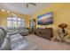 Comfortable living room featuring a large TV, modern furnishings, and tiled floors at 6251 Vista Verde W Dr, St Petersburg, FL 33707
